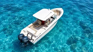 Hatchling, a 28 ft Grady White bowrider, viewed from above in Grand Cayman's blue water